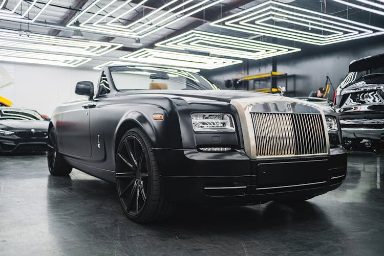 Modern Black Car Parked In Garage