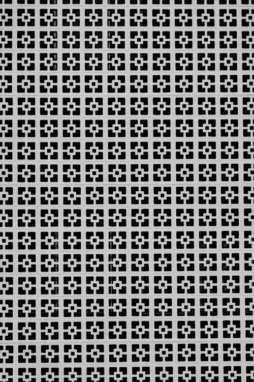 Checkered background of black and white colors with small squares ornament forming geometric net pattern