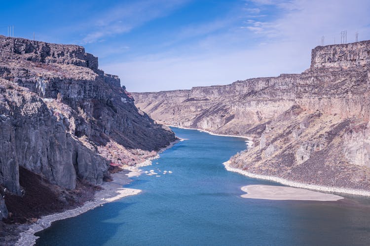 Curvy Calm River Between Rocky Cliffs