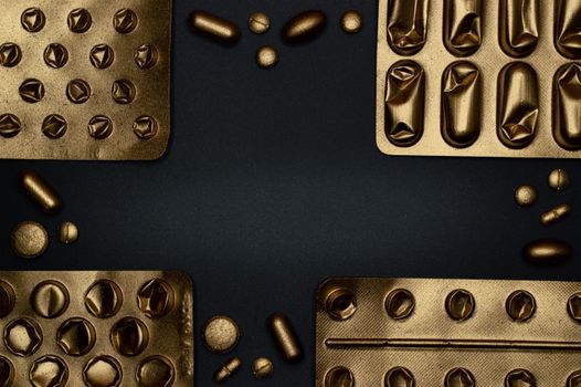 Close-up of metallic pills and blister packs on a dark surface, showcasing healthcare themes.