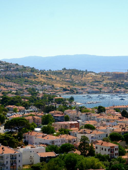 Free Sunny aerial view of Çeşme, Türkiye, featuring red-roofed houses and the Aegean Sea. Stock Photo