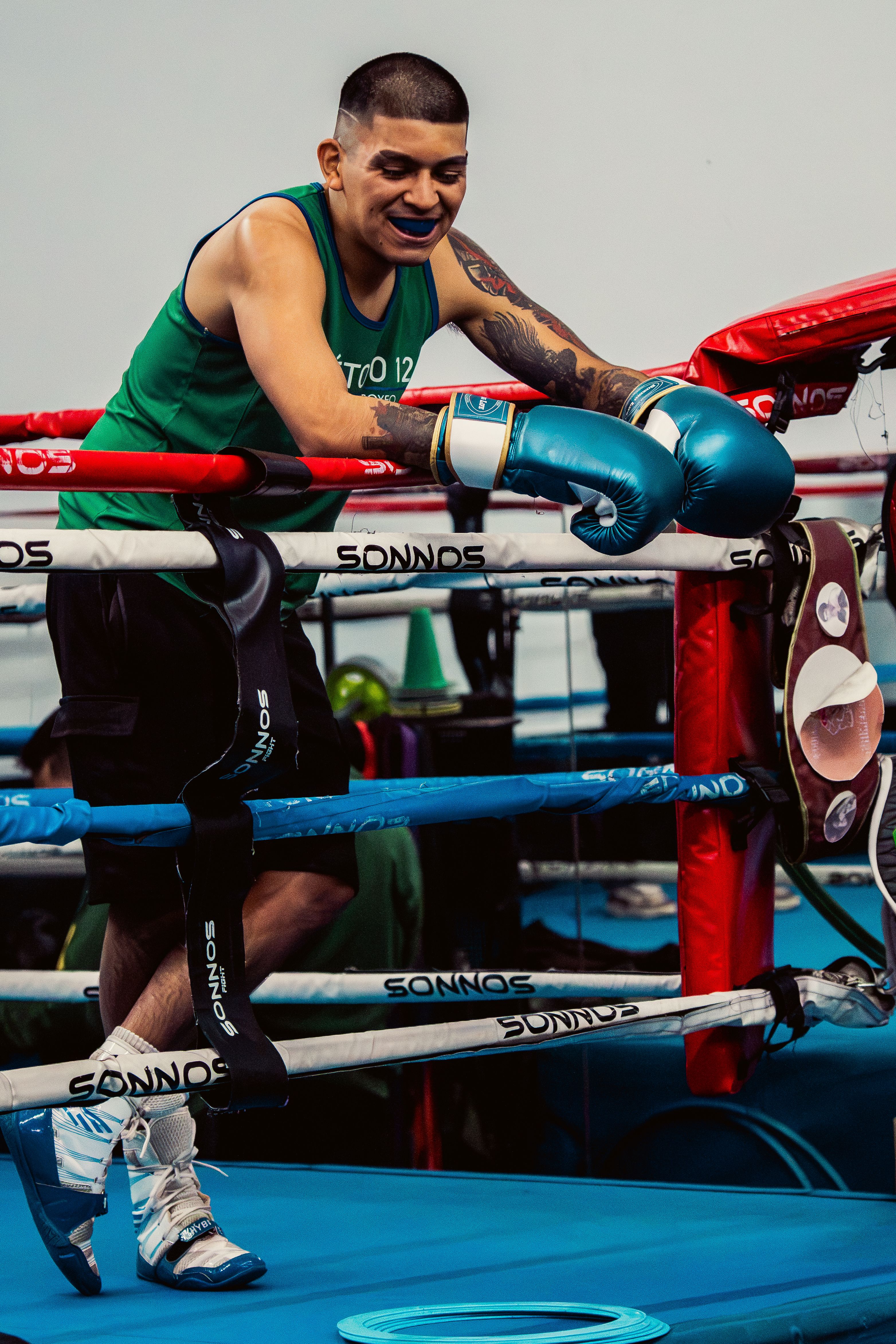 A dedicated boxer practicing in a Buenos Aires gym, showcasing intense focus and athletic skill.