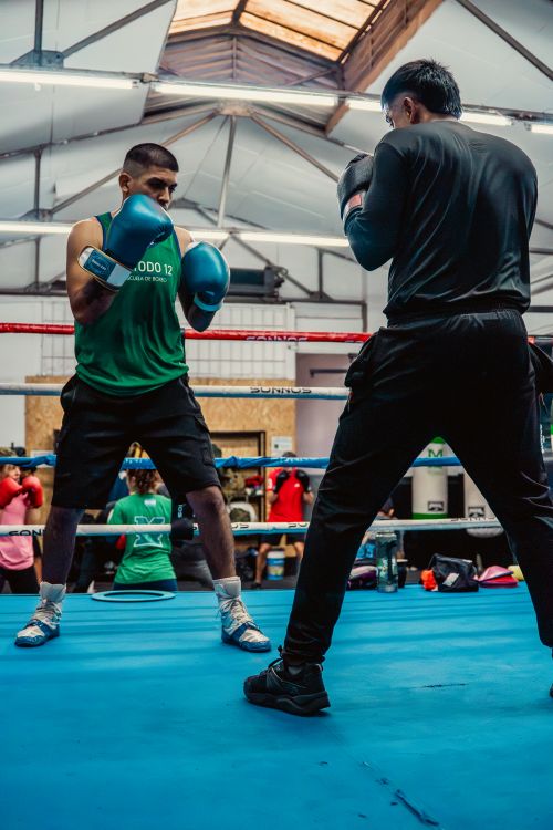 Free Boxers sparring in a professional gym in Buenos Aires, showcasing focus and athleticism. Stock Photo
