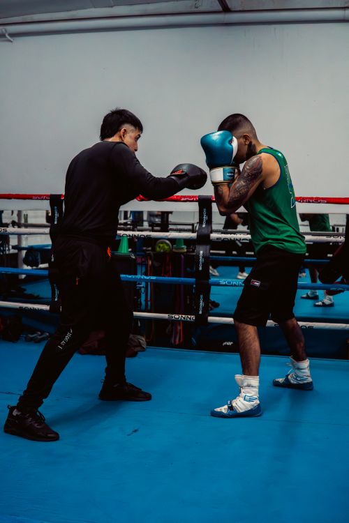 Free Two male boxers engaging in a high-energy training session at a gym in Buenos Aires, Argentina. Stock Photo