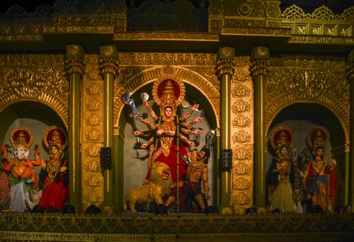 Free A vibrant display of Goddess Durga with intricate carvings during Durga Puja festival. Stock Photo