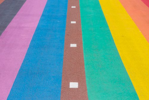 Free Abstract colorful road with rainbow stripes and dotted lines, perfect for creative projects. Stock Photo