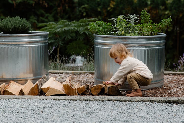 Child Playing With Woods