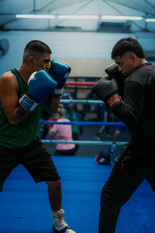Free Intense boxing match between two athletes in a Buenos Aires gym. Stock Photo