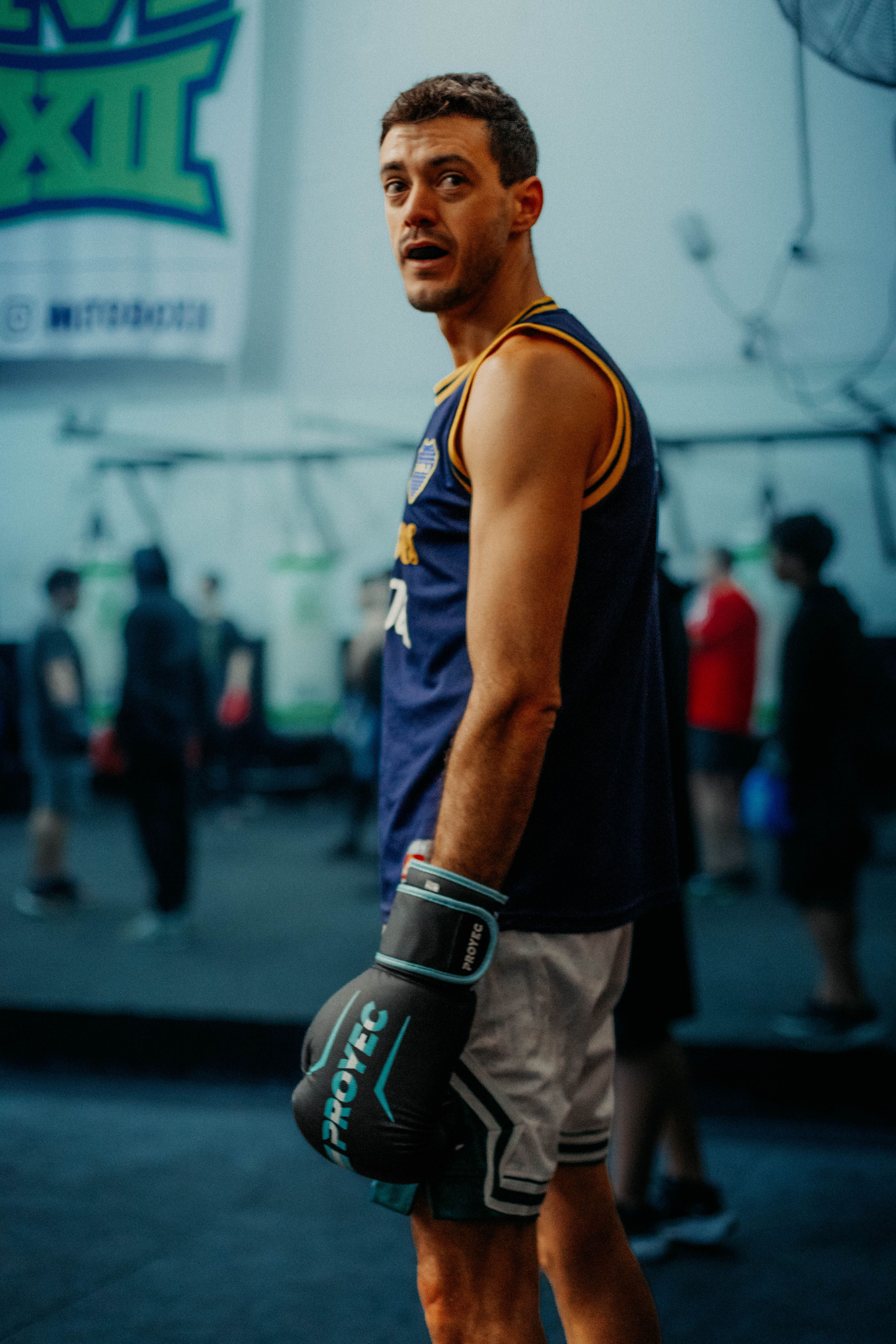 A boxer in workout gear and gloves in a Buenos Aires gym.
