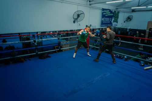 Free Two boxers sparring in a Buenos Aires gym, showcasing intense training dynamics. Stock Photo
