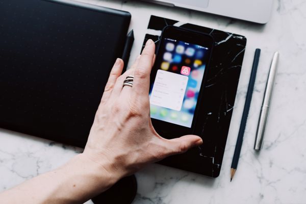 Phone app interface in hand — ready made on Pexels