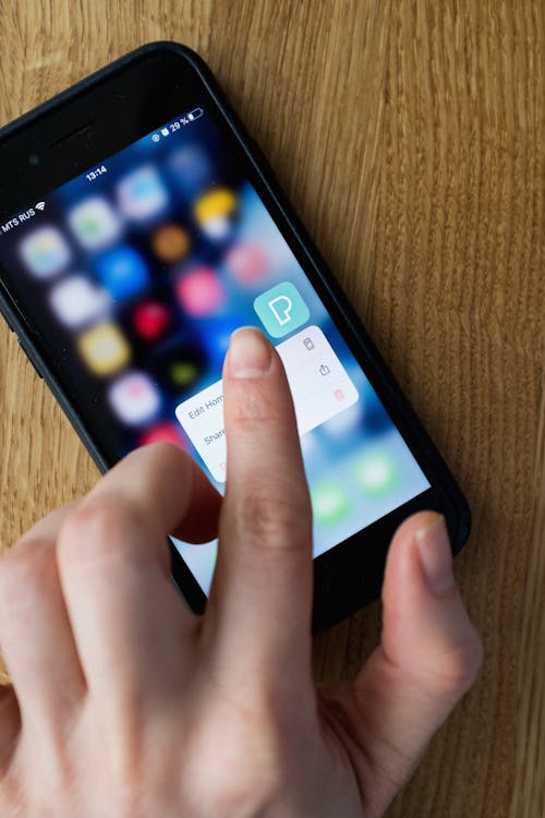 Person Holding Black Smartphone