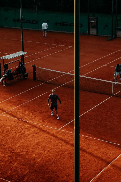 Free A dynamic tennis match on a clay court in Buenos Aires, capturing sport and competition. Stock Photo