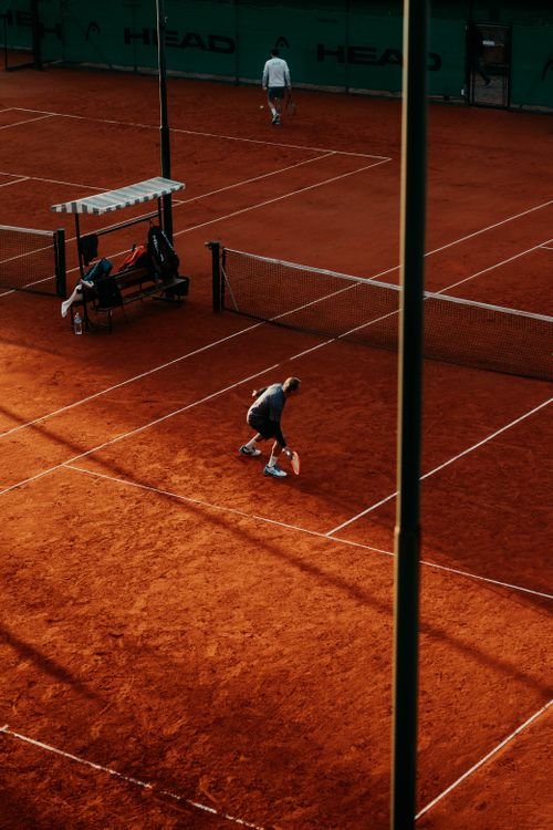 Free Dynamic tennis match on a clay court in Buenos Aires, Argentina with a focus on players and sport. Stock Photo