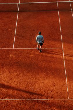 Overhead view of a player on a clay court — photo by Gera Cejas on Pexels