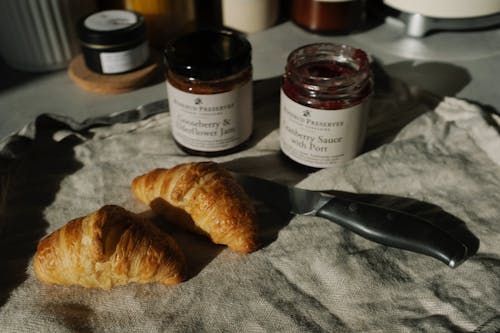 Free Bread Beside Knife On Gray Textile Stock Photo