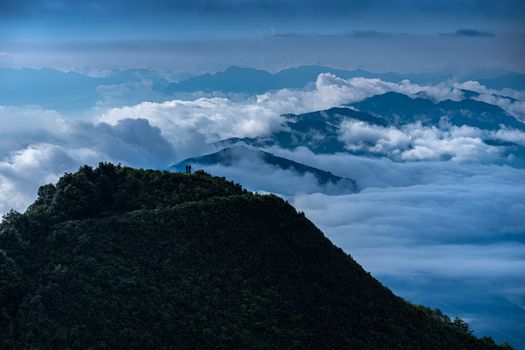 A breathtaking view of mountains above the clouds, perfect for travel and nature concepts.
