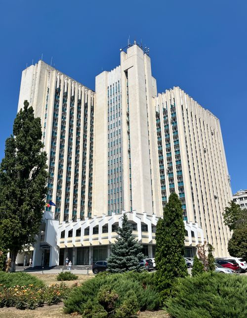 Free Stunning view of a landmark building in Chișinău, surrounded by lush greenery under a clear blue sky. Stock Photo