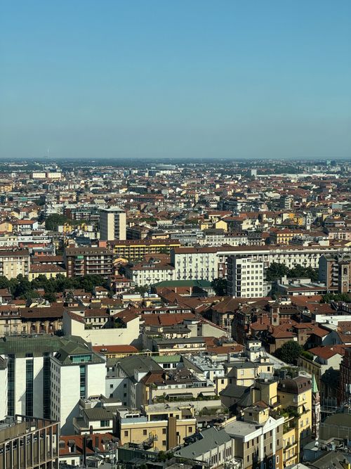 Free Expansive aerial view of Milan's urban cityscape showcasing dense architecture and city planning. Stock Photo
