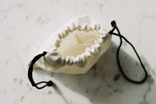 White fabric pouch with drawstring