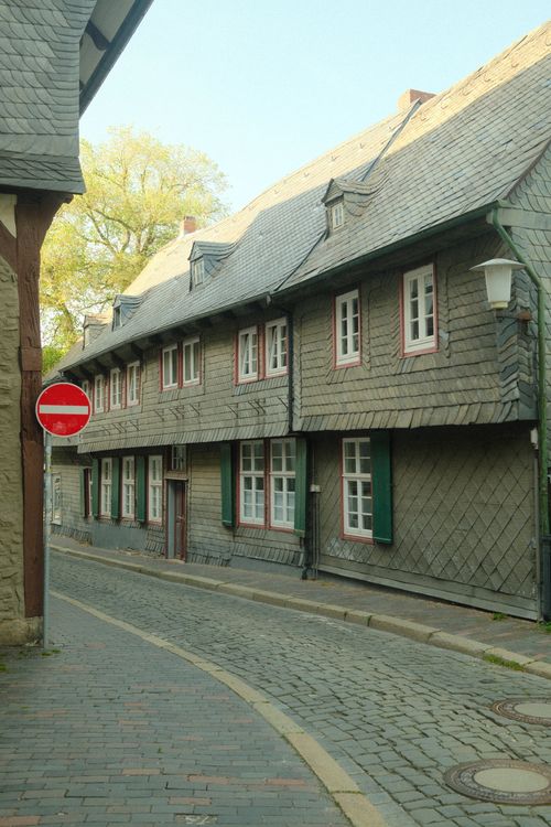 Free Quaint cobblestone street and half-timbered houses in Goslar, Germany, captured on a serene day. Stock Photo