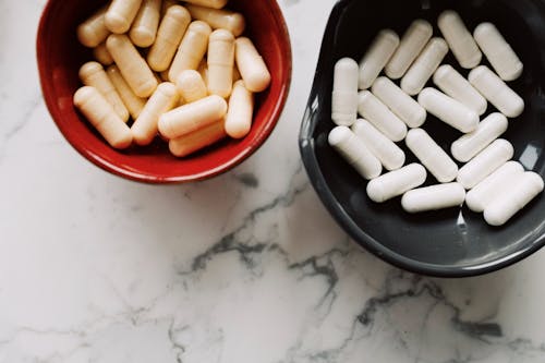 Free White Medication Pill On Bowls Stock Photo