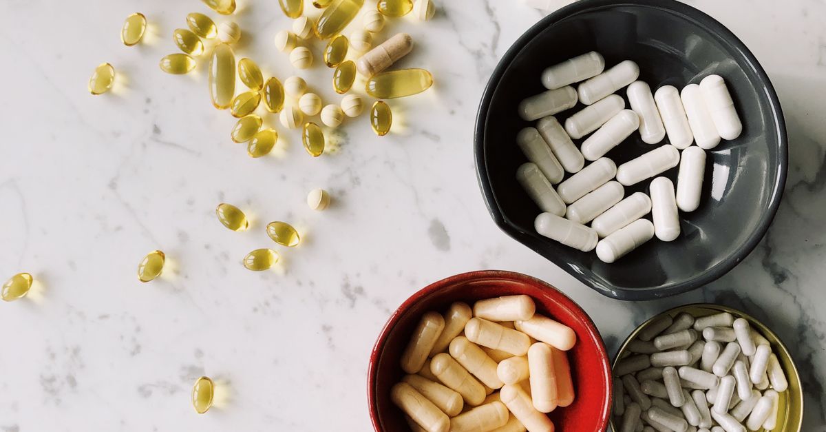 Sorting of various capsules in different shells on desk in hospital ...