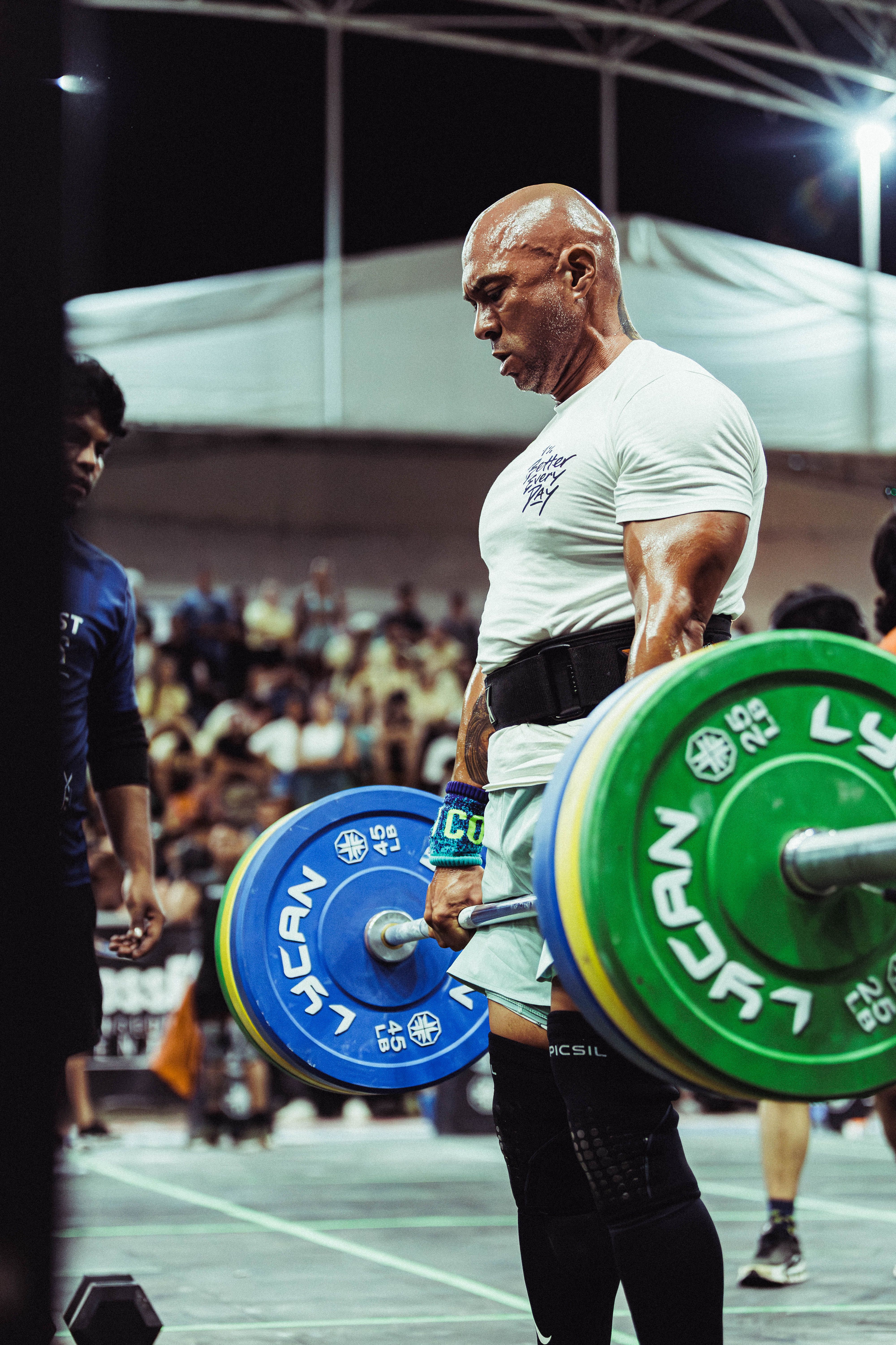Portrait of coach Ray Okafor performing a deadlift during a powerlifting competition