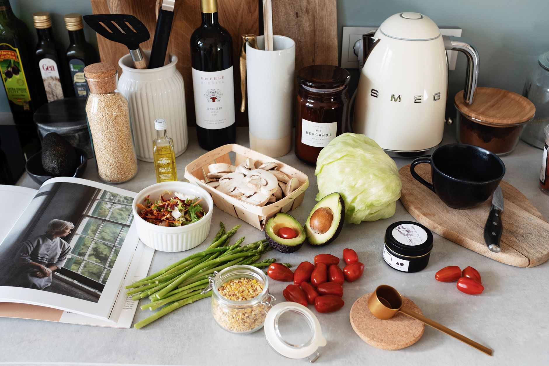 A variety of fresh ingredients and kitchen tools for preparing a healthy meal.
