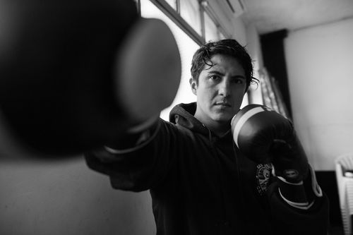 Free Black and white image of a boxer practicing punches indoors in Buenos Aires. Stock Photo
