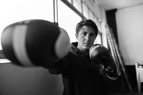 Free A determined boxer practices in an indoor gym in Buenos Aires, showcasing strength and focus. Stock Photo