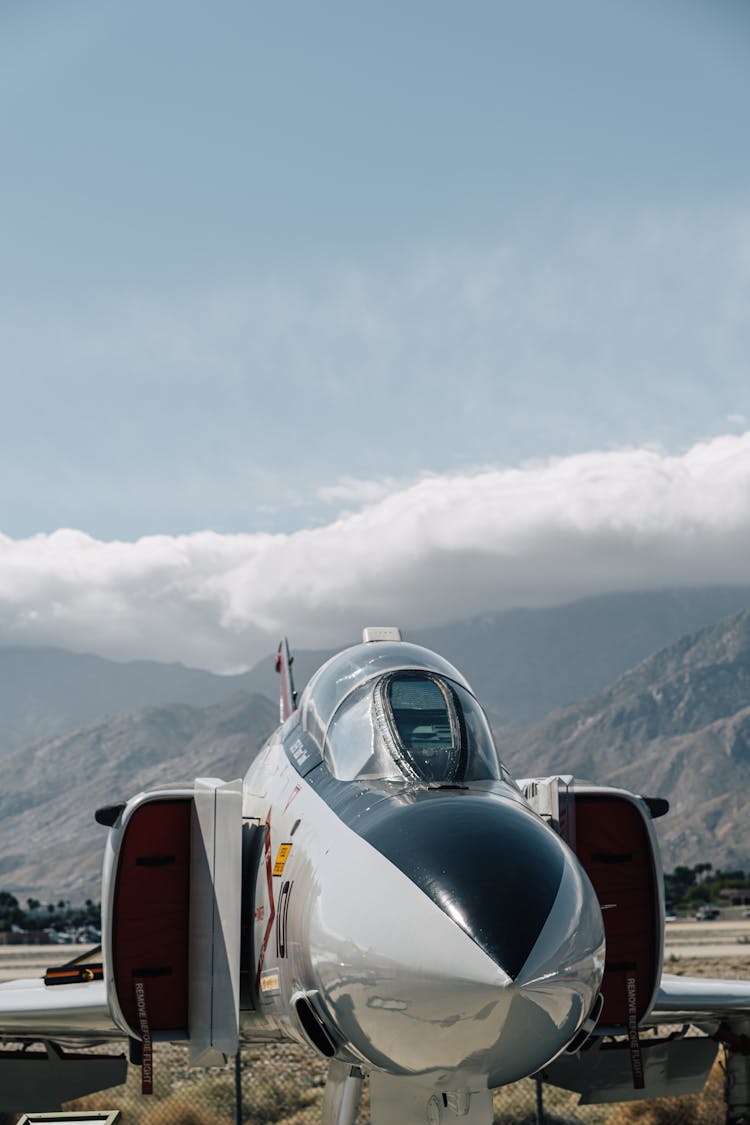 Military Aircraft Parked On Rocky Highland