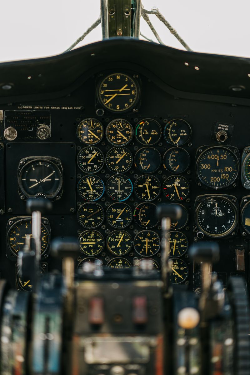 Aircraft cockpit instrument panel showing navigation gauges and avionics displays