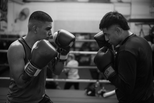 Free Two boxers face off in a Buenos Aires gym, capturing the intensity of training. Stock Photo
