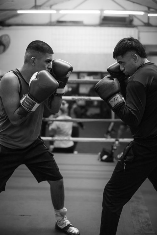 Free Two men engaged in a focused boxing match at a gym in Buenos Aires, Argentina. Stock Photo