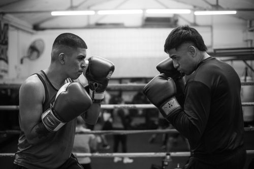 Free Two men sparring in a boxing gym in Buenos Aires, showcasing technique and intensity. Stock Photo