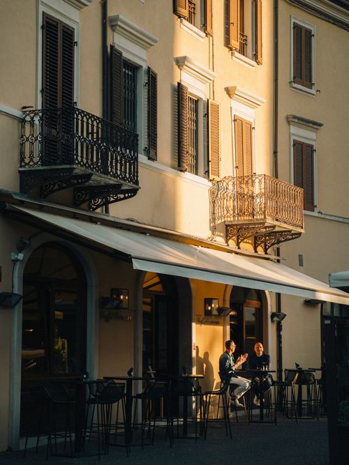 Free Warm sunlit street in Emilia-Romagna, highlighting Italian architecture. Stock Photo