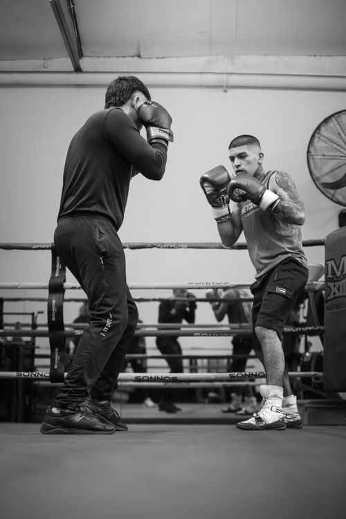 Free Two male boxers sparring in a Buenos Aires gym, showcasing intense training and technique. Stock Photo