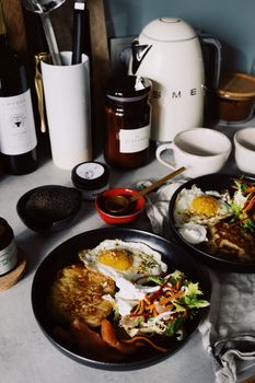 Elegant breakfast setup with eggs and fresh salad in a stylishly modern kitchen atmosphere.