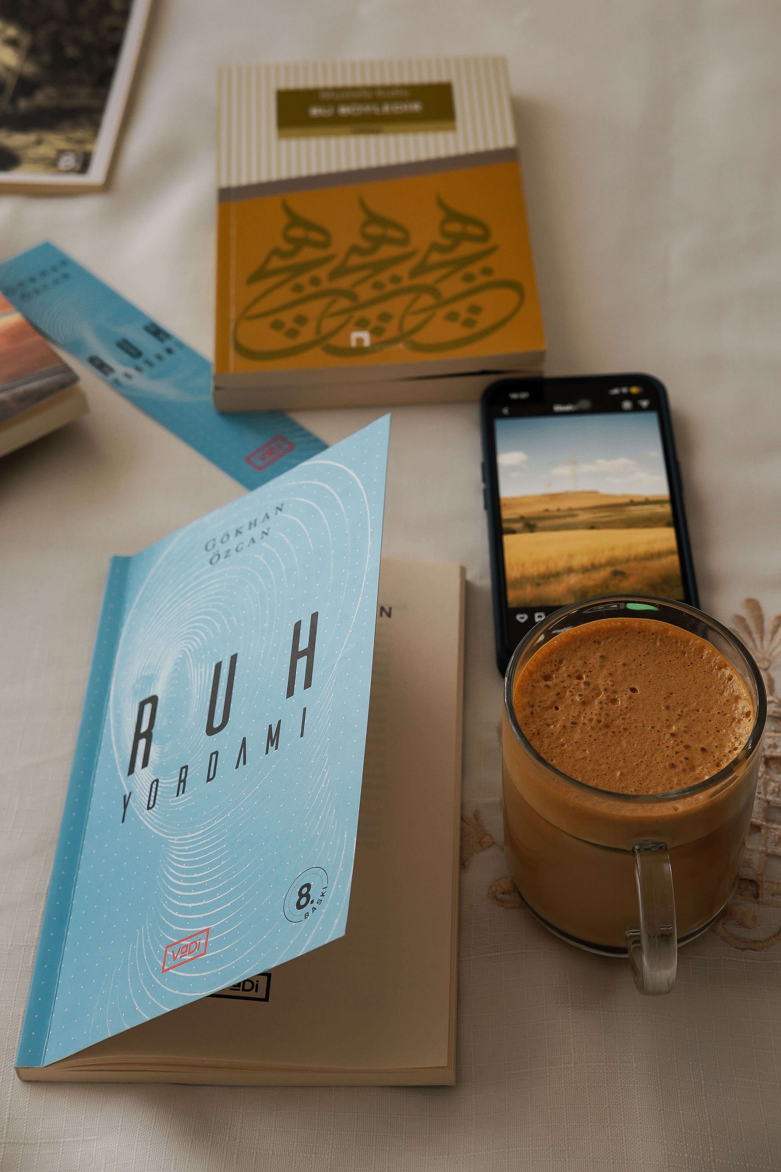 Relaxing scene of books and coffee on a table, perfect for a cozy reading session.