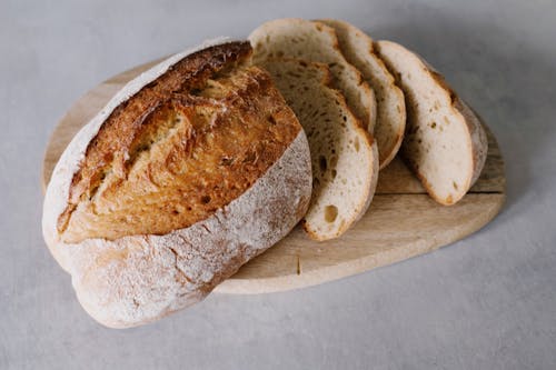 Free Bread On Brown Wooden Chopping Board Stock Photo