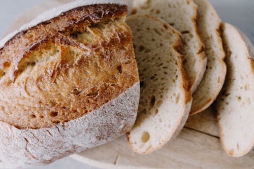 Free Bread On Brown Wooden Chopping Board Stock Photo