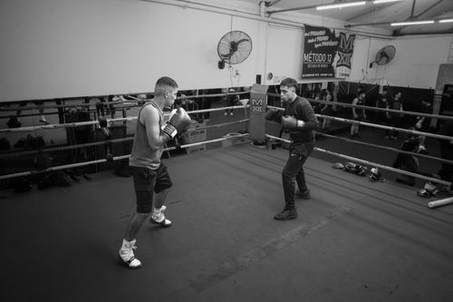 Free Two men sparring in a boxing ring at an indoor gym in Argentina, displaying boxing techniques. Stock Photo
