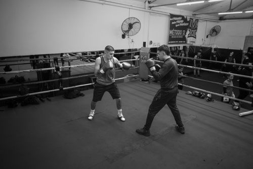 Free Boxers spar in a gym in Argentina during practice, showcasing skill and athleticism. Stock Photo