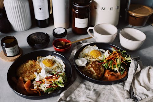 Cooked Food On Black Ceramic Plates 