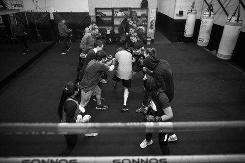 Free A group of diverse adults participate in a boxing class in Argentina, focusing on teamwork and fitness. Stock Photo
