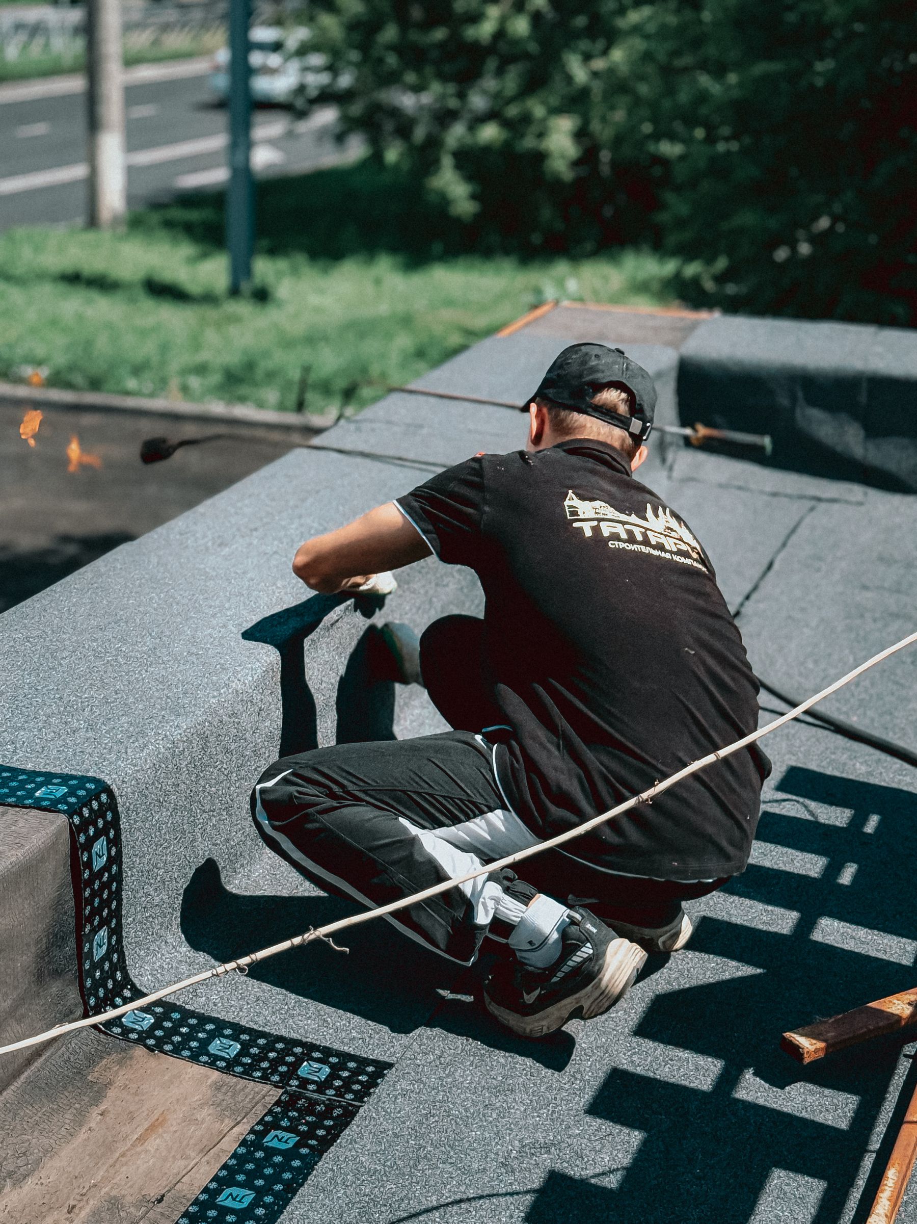 Roofer working on a commercial flat roof