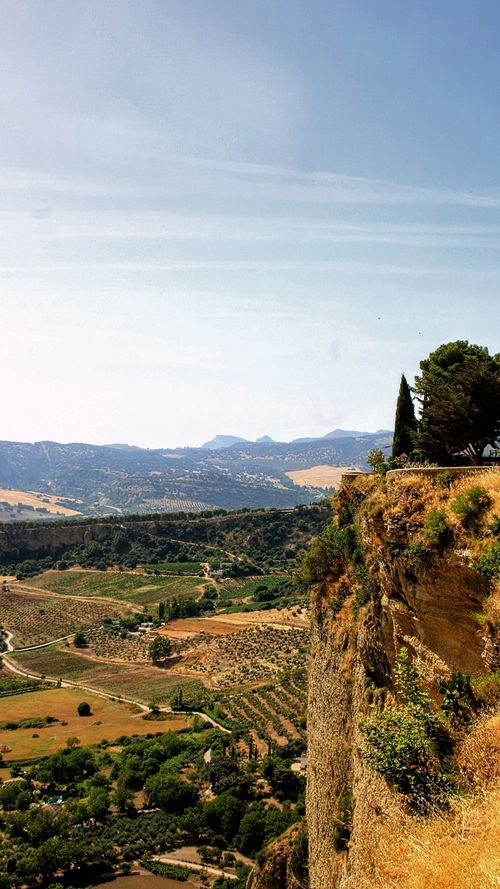Free Breathtaking view of El Tajo gorge and lush valleys in Ronda, Spain. Stock Photo