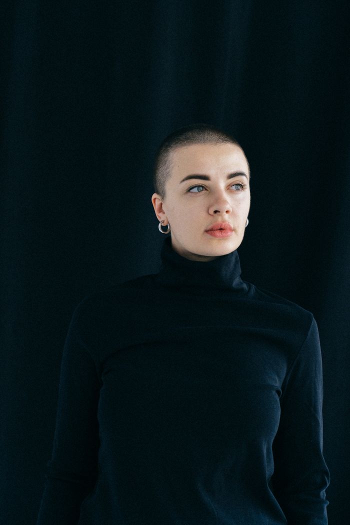 Studio portrait of a sound designer against a dark backdrop — photo by Anna Shvets on Pexels
