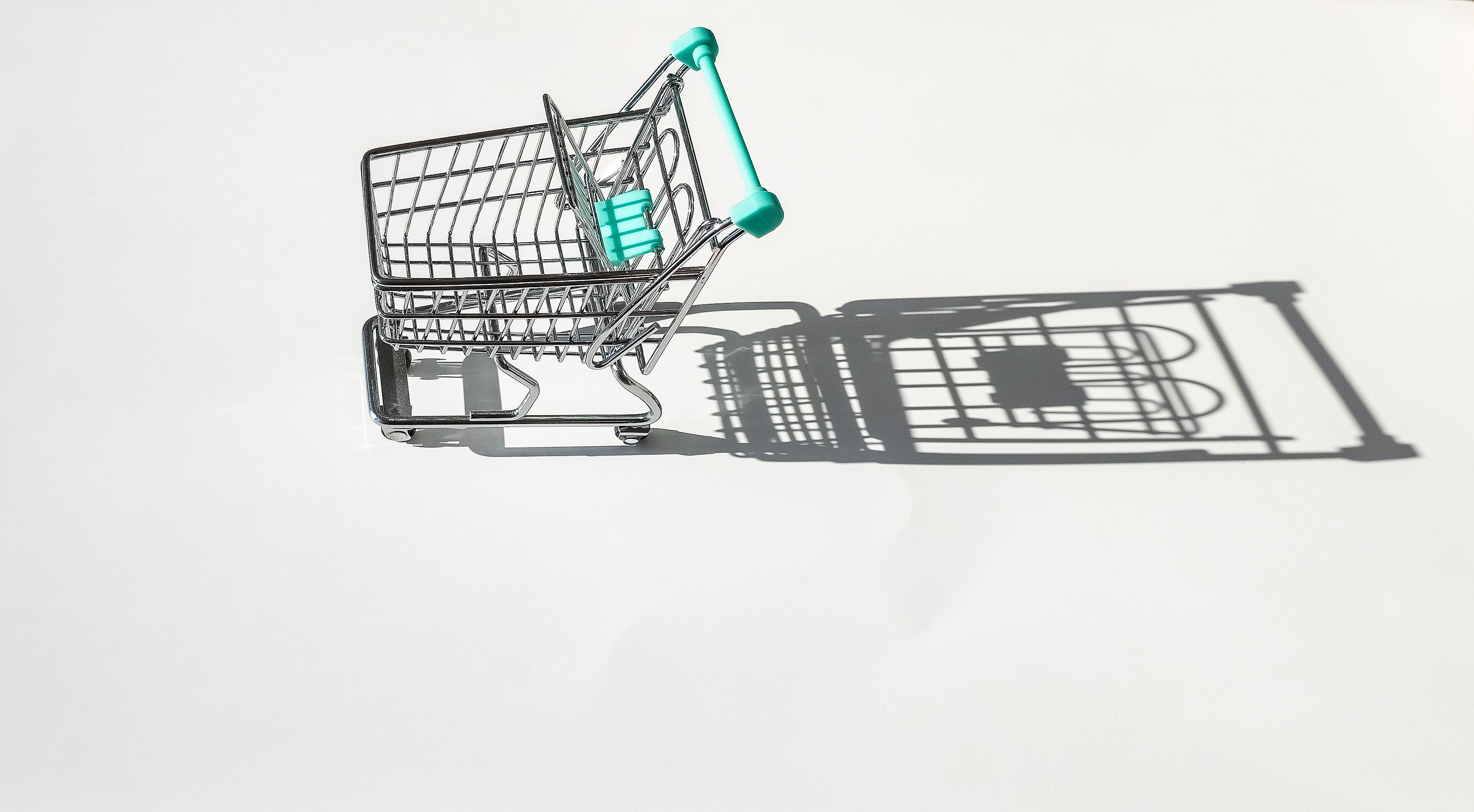 Graphic showing a shrinking shopping basket representing reduced purchasing power.